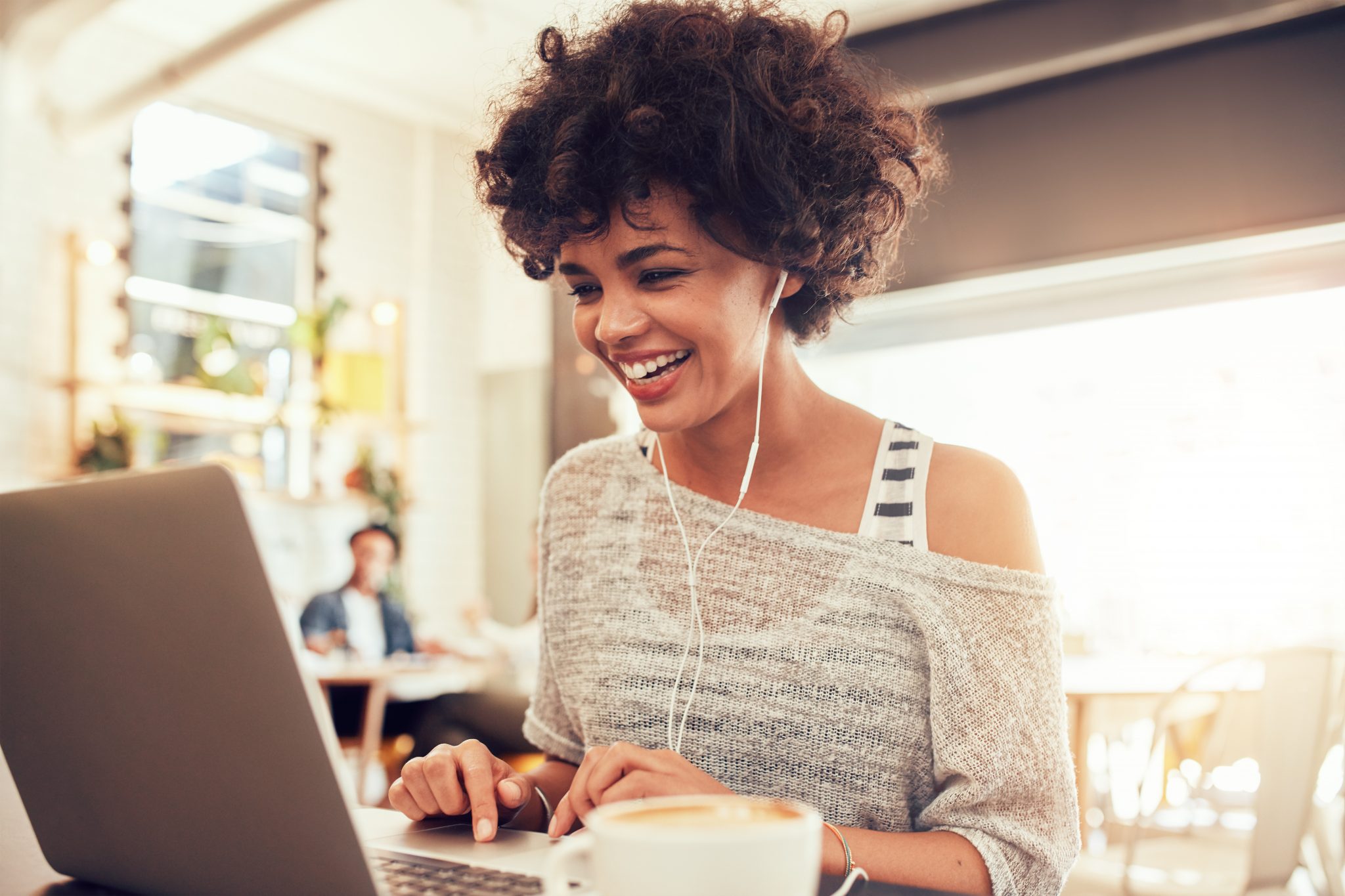 Woman transcribing and editing audio files on a computer